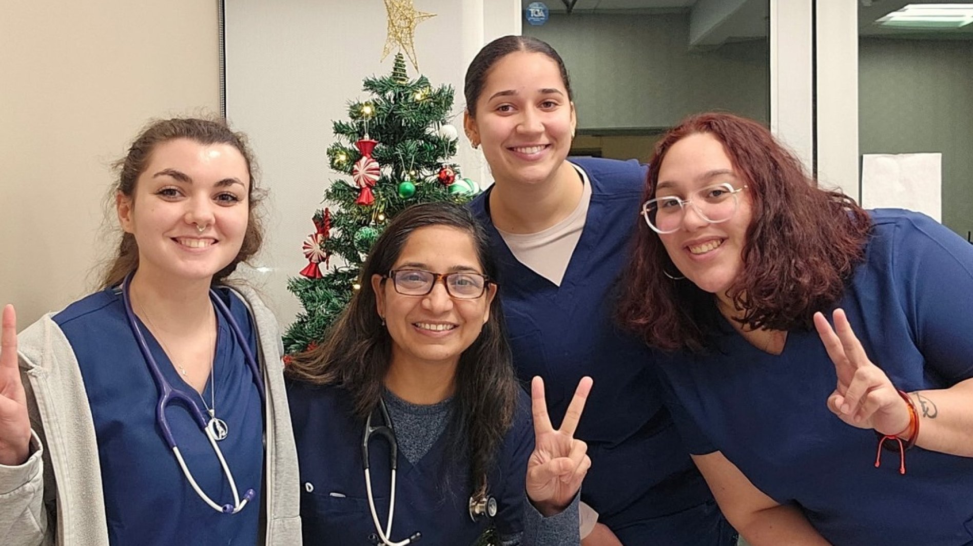 Vivavets team posing together inside clinic